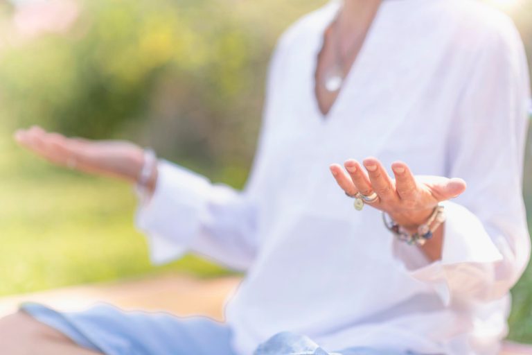 A person conducting meditation classes for Windsor residents preparing for classes
