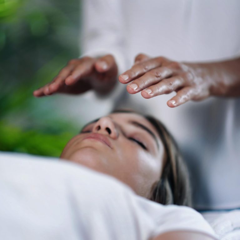 Hands above body during energy work - calm moment in reiki near Windsor