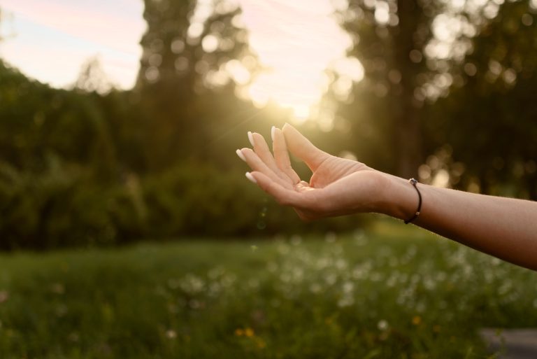 Close-up of practitioner’s hands - subtle energy flow during reiki near Reading