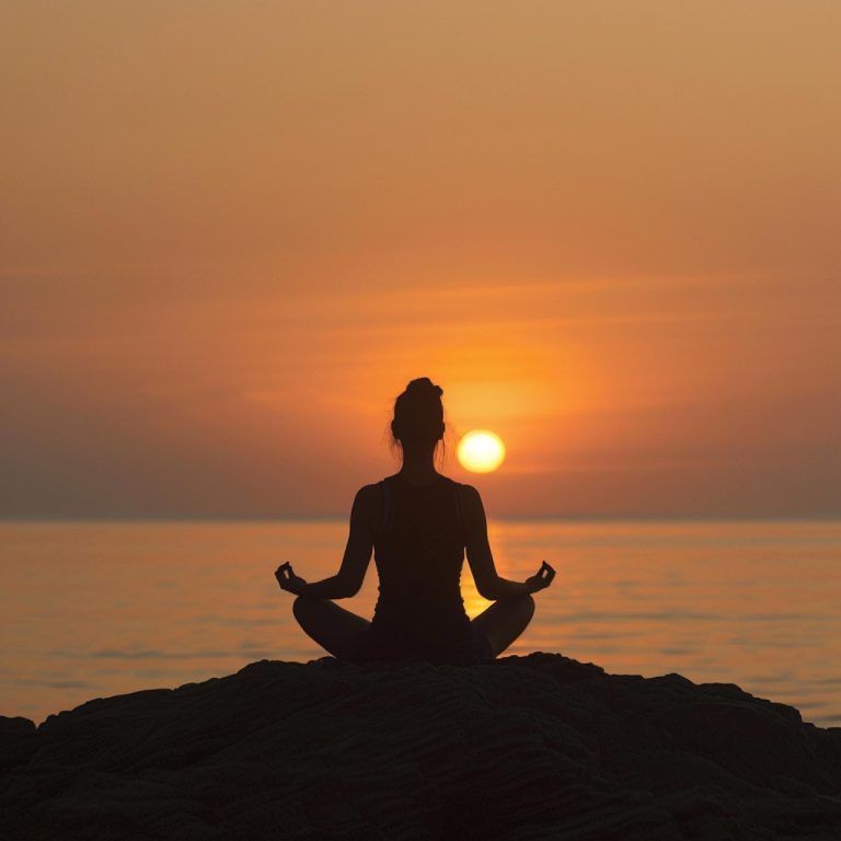 A person meditating effectively after meditation classes near Newbury, with the setting sun in the background