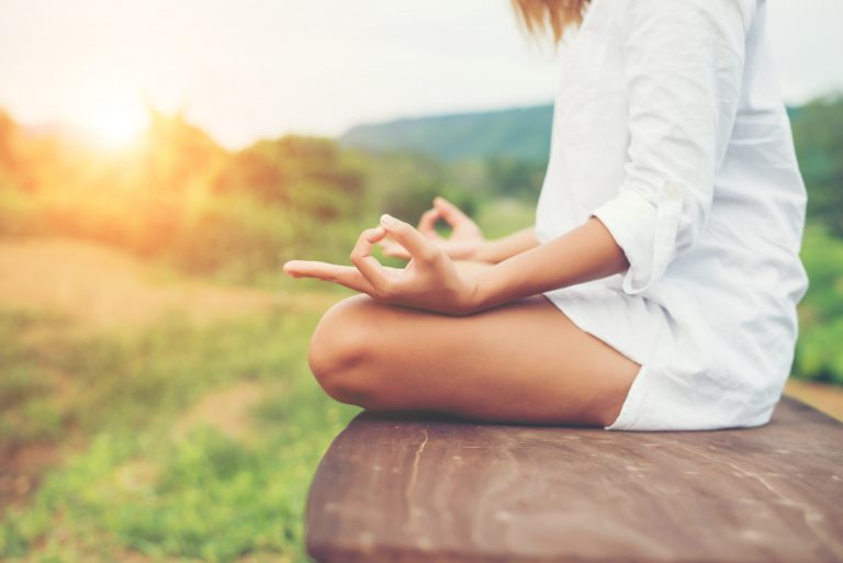 Woman sitting in stillness - meditation near Reading for emotional clarity