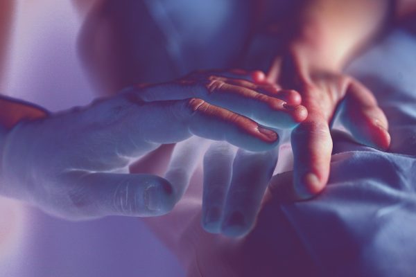 Hands offering healing energy during reiki session in Bracknell